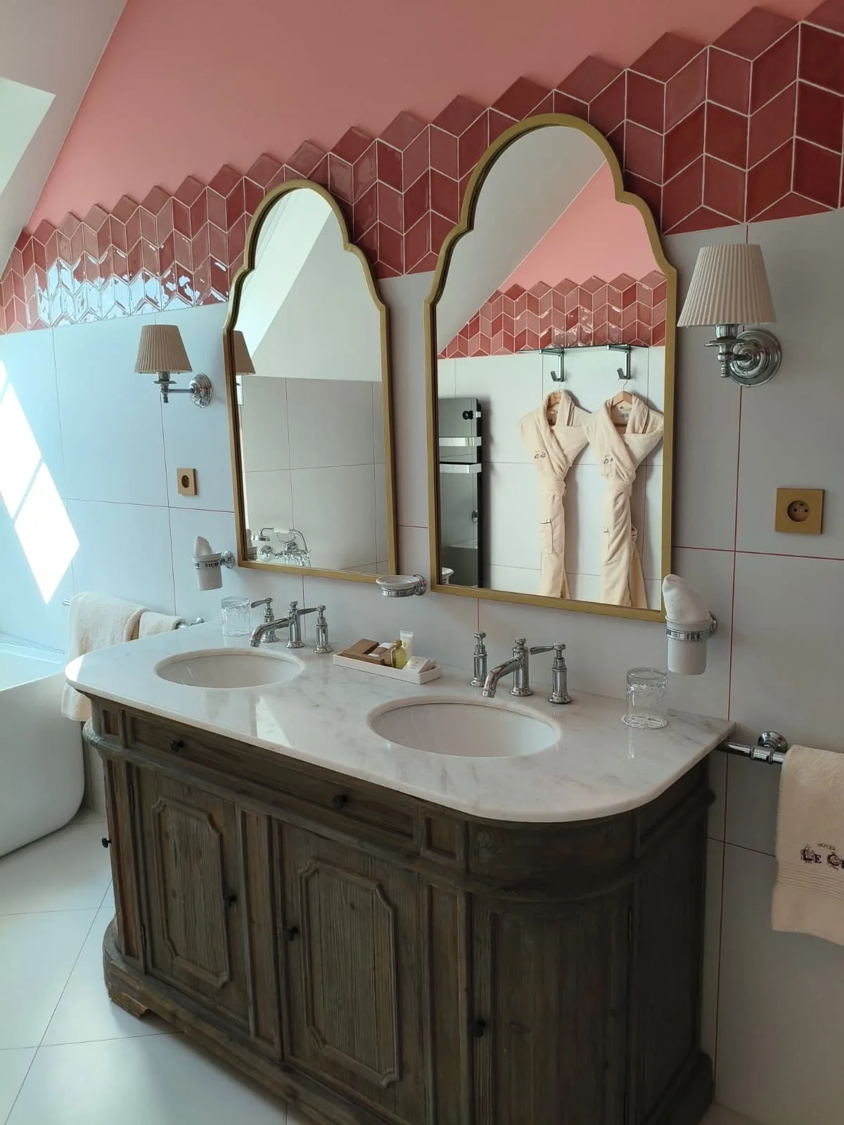 Marble double-vanity bathroom with coral tiles at Le Cep in Beaune