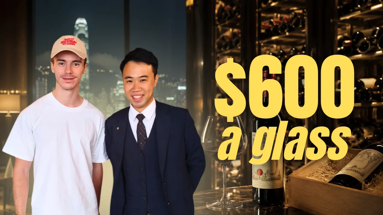 Antoine and Cyrus Ho, hotel sommelier at Island Shangri-La Hong Kong, in the hotel's wine cellar above a bottle of Petrus