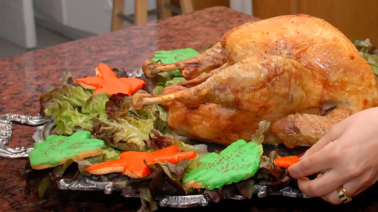 A golden roast turkey presented on a silver platter