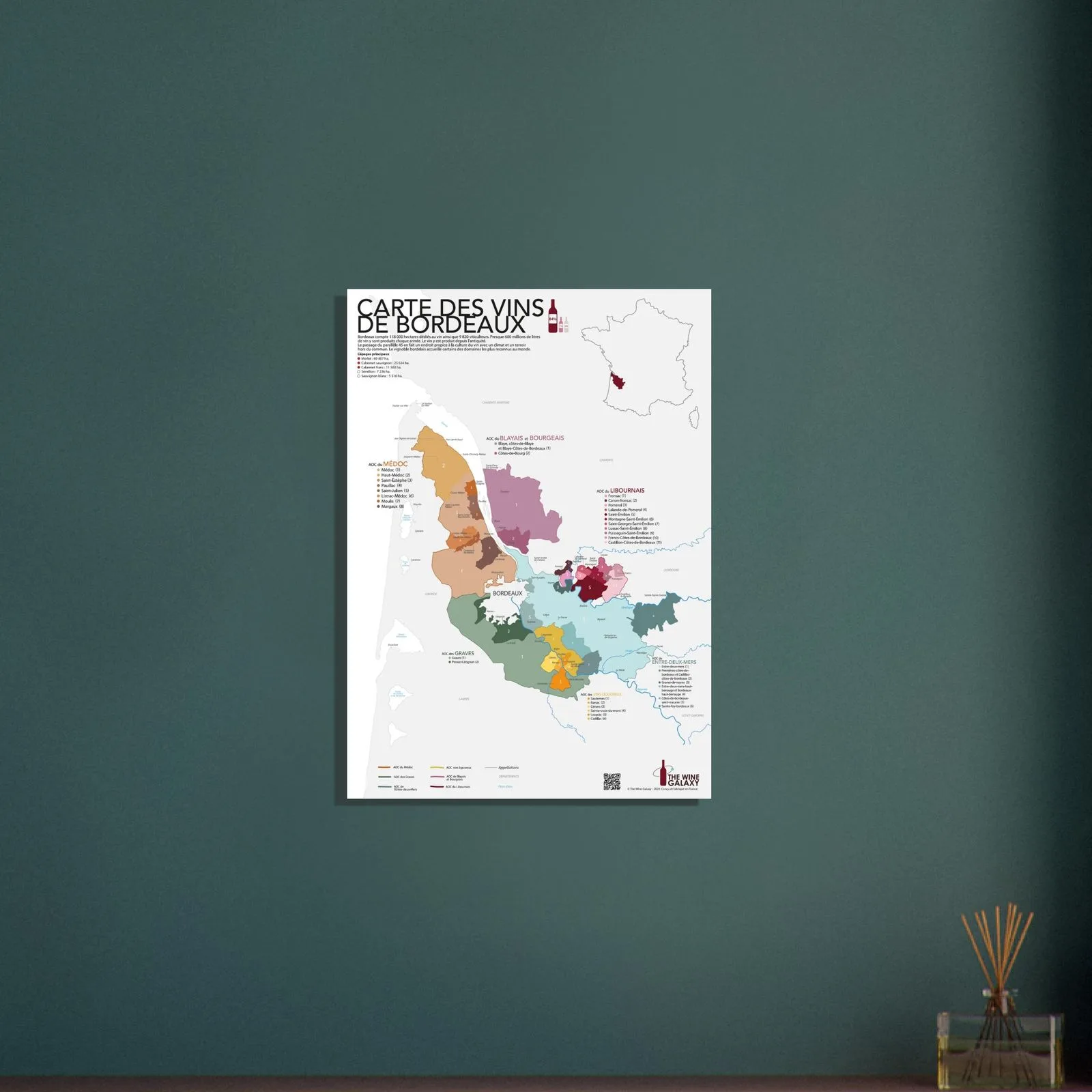 The Bordeaux wine map framed above a dining table