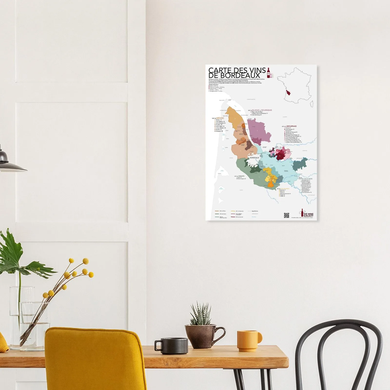 The Bordeaux wine map on the wall above a wine rack